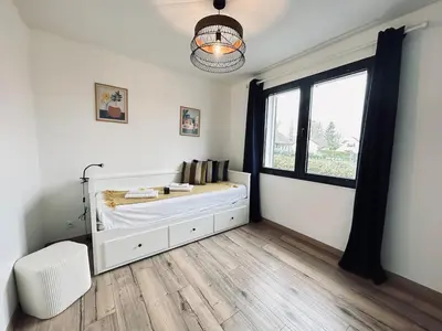 Un ou plusieurs lits dans un hébergement de l'établissement La maison des vignes 3chambres jardin proche Reims