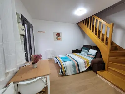 Un ou plusieurs lits dans un hébergement de l'établissement Duplex apartment 700 m from Compiègne train station