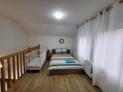 Un ou plusieurs lits dans un hébergement de l'établissement Duplex apartment 700 m from Compiègne train station