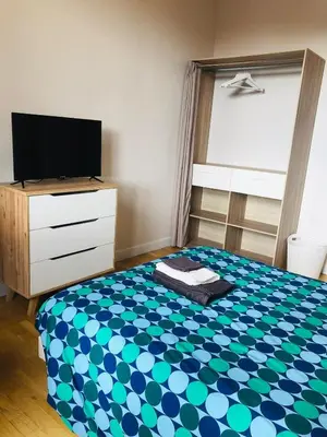 Un ou plusieurs lits dans un hébergement de l'établissement Neufchatel superbe appartement 3 chambres