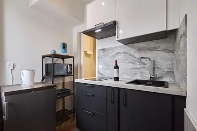 Cuisine ou kitchenette dans l'établissement Le Comte - T1 - 5 mins Caves Champagne