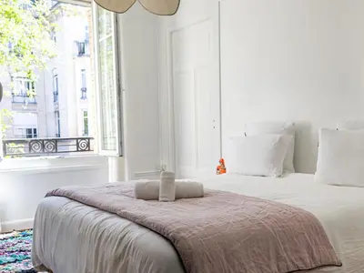 Un ou plusieurs lits dans un hébergement de l'établissement Appartement au pied de la Cathédrale - Reims Centre