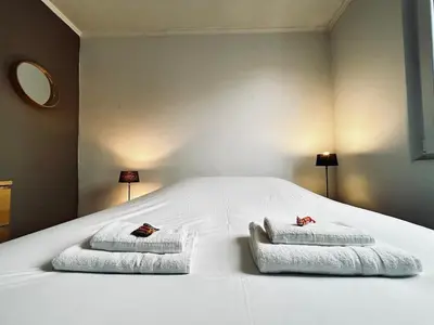Un ou plusieurs lits dans un hébergement de l'établissement Une bulle en champagne T3 hyper centre avec balcon