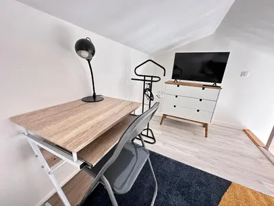 Télévision ou salle de divertissement dans l'établissement Le pilier un cocon en duplex proche centre ville