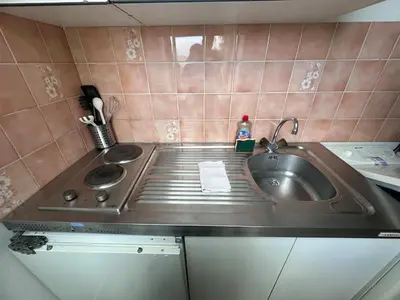 Cuisine ou kitchenette dans l'établissement Calvaire charmant studio rénové proche gare