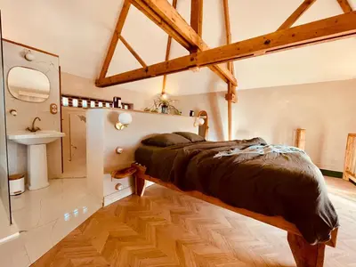 Un ou plusieurs lits dans un hébergement de l'établissement Évasion nature et bien-être - SPA - Petit Déjeuner