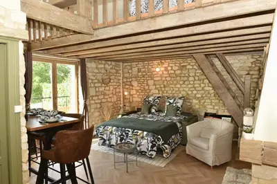 Un ou plusieurs lits dans un hébergement de l'établissement Charmante maisonnette au calme