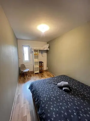Un ou plusieurs lits dans un hébergement de l'établissement Appartement avec terrasse
