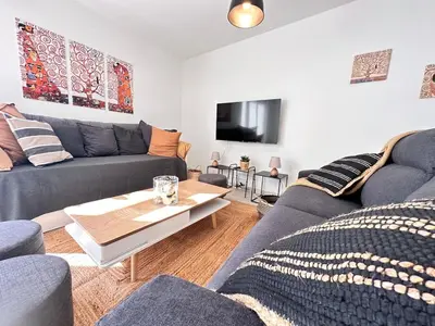 Coin salon dans l'établissement Gite 10 personnes avec jacuzzi à 10 min de Reims