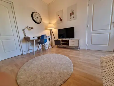 Télévision ou salle de divertissement dans l'établissement Mont d'arène superbe appartement proche gare