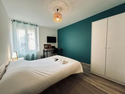 Un ou plusieurs lits dans un hébergement de l'établissement Maison de charme Reims 8 chambres, 8 salle de bain