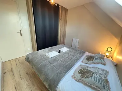 Un ou plusieurs lits dans un hébergement de l'établissement Danton confortable chaleureux proche centre-ville