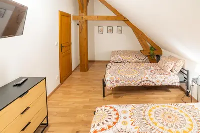 Un ou plusieurs lits dans un hébergement de l'établissement Jolie maisonnette