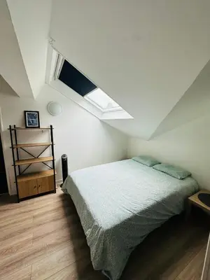 Un ou plusieurs lits dans un hébergement de l'établissement Le studio du moulin