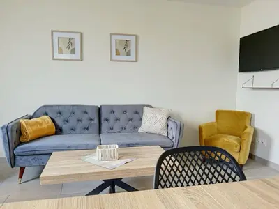 Coin salon dans l'établissement Le Gîte de la Forêt Montmacq