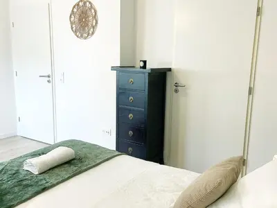 Un ou plusieurs lits dans un hébergement de l'établissement Chez Pablo, maison avec jardin et parking privé