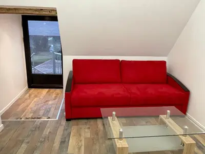 Coin salon dans l'établissement APPARTEMENT MODERNE DANS FERME DU 13éme SIECLE
