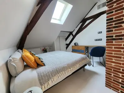 Un ou plusieurs lits dans un hébergement de l'établissement Les Bulles d'Aÿ - Loft