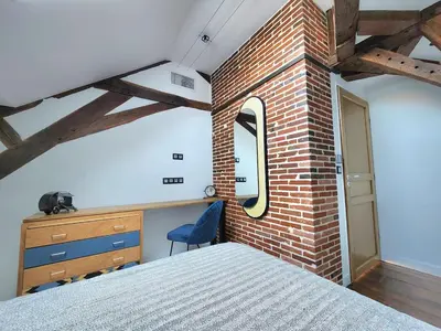 Un ou plusieurs lits dans un hébergement de l'établissement Les Bulles d'Aÿ - Loft