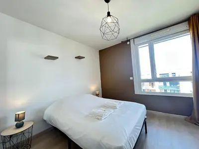 Un ou plusieurs lits dans un hébergement de l'établissement Rooftop 6 pers, 2 Sdb avec terrasse