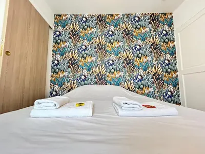 Un ou plusieurs lits dans un hébergement de l'établissement Chamonix magnifique duplex avec terrasse au centre