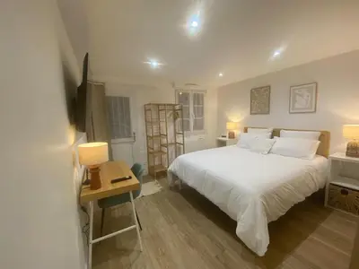 Un ou plusieurs lits dans un hébergement de l'établissement Le Nid'Ophé Studio Cosy - Proche Disneyland Paris