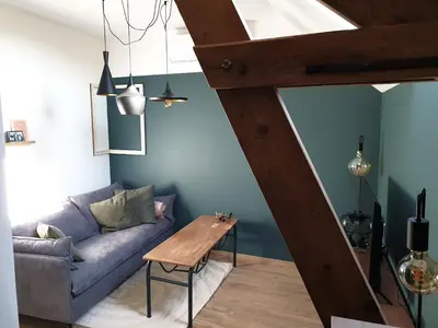 Coin salon dans l'établissement Appartement La Buissonnière