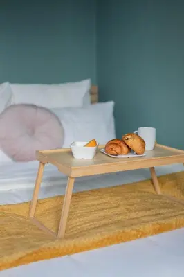 Un ou plusieurs lits dans un hébergement de l'établissement Cozy apartment - Downtown Place d'Erlon