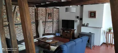 Télévision ou salle de divertissement dans l'établissement La ferme des gribouts