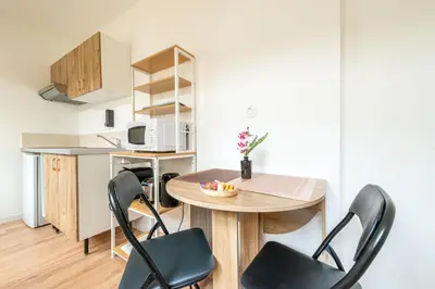 Cuisine ou kitchenette dans l'établissement Résidence de l'Industrie