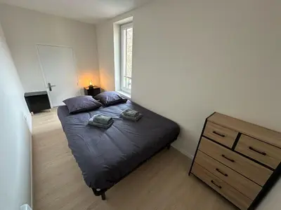 Un ou plusieurs lits dans un hébergement de l'établissement Le chal'heureux, Appartement chic au cœur d'Épernay