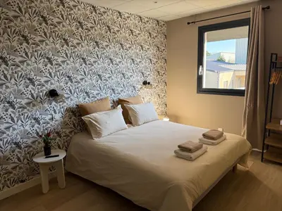 Un ou plusieurs lits dans un hébergement de l'établissement Suite du Spa 1 - Parking Privé Gratuit