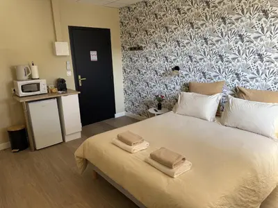 Un ou plusieurs lits dans un hébergement de l'établissement Suite du Spa 1 - Parking Privé Gratuit