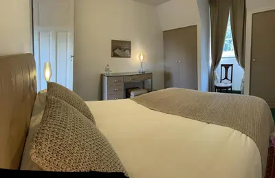 Un ou plusieurs lits dans un hébergement de l'établissement L'Auberge du Château