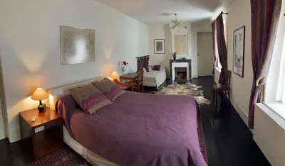 Un ou plusieurs lits dans un hébergement de l'établissement L'Auberge du Château