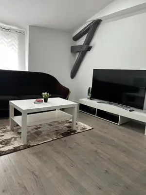 Télévision ou salle de divertissement dans l'établissement Le nid du 4