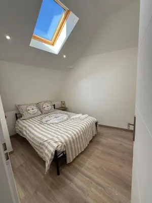 Un ou plusieurs lits dans un hébergement de l'établissement Appartement en Champagne