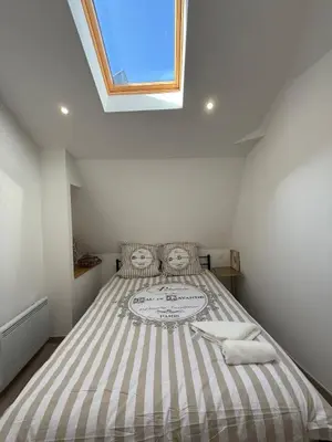 Un ou plusieurs lits dans un hébergement de l'établissement Appartement en Champagne