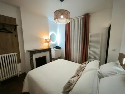 Un ou plusieurs lits dans un hébergement de l'établissement Gîte Champagne Philippe Moutardier - Chambre Arôme