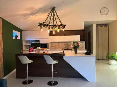 Cuisine ou kitchenette dans l'établissement La Champoternoise