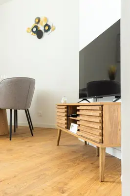 Télévision ou salle de divertissement dans l'établissement Le Châlons Cosy T2 calme