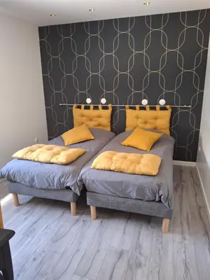 Un ou plusieurs lits dans un hébergement de l'établissement La maison d'à côté Chambre 1