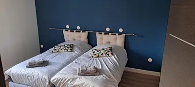 Un ou plusieurs lits dans un hébergement de l'établissement la Maison d'à côté Chambre 3