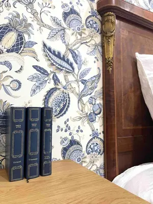 Un ou plusieurs lits dans un hébergement de l'établissement La roulotte du Manoir 1900