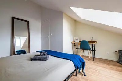 Un ou plusieurs lits dans un hébergement de l'établissement Maison du Barbâtre - 4 chambres chaleureuses