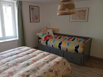 Un ou plusieurs lits dans un hébergement de l'établissement Magnifique hébergement en Rez de jardin