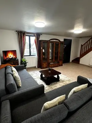 Coin salon dans l'établissement Maison familiale Vintage à Meaux