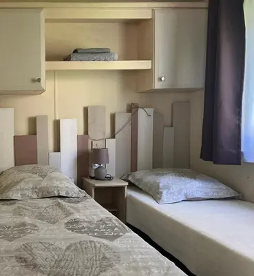 Un ou plusieurs lits dans un hébergement de l'établissement Lodge de Valébrune
