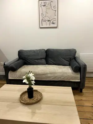 Coin salon dans l'établissement Appartement