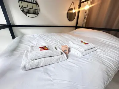 Un ou plusieurs lits dans un hébergement de l'établissement Talleyrand studio neuf cozy hyper centre
